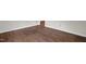 Empty room with polished hardwood floors and white trim details at 714 W Mckinley St, Mebane, NC 27302