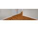 Hallway featuring hardwood floors, two doors and white trim at 714 W Mckinley St, Mebane, NC 27302