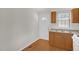 Functional kitchen showcasing a white door and wood cabinets at 714 W Mckinley St, Mebane, NC 27302