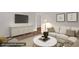 Cozy living room featuring stylish decor and comfortable seating at 714 W Mckinley St, Mebane, NC 27302
