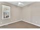 A carpeted bedroom featuring neutral walls and a window with blinds at 750 James Norris Rd, Angier, NC 27501