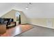 Bedroom with hardwood accent and carpeting, vaulted ceiling and desk with dual monitors at 750 James Norris Rd, Angier, NC 27501