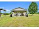 View of the exterior of a tan home with a covered porch at 750 James Norris Rd, Angier, NC 27501