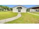 Detached building with a black awning, sliding door entrance and ample lawn space at 750 James Norris Rd, Angier, NC 27501