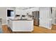 Bright kitchen featuring white cabinetry, stainless steel appliances, and a center island at 750 James Norris Rd, Angier, NC 27501