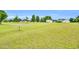 An expansive lot with green grass and scattered trees offers endless possibilities for outdoor activities and enjoyment at 750 James Norris Rd, Angier, NC 27501