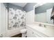 Well-lit bathroom featuring a tub, toilet, and a vanity with a white countertop and classic faucet at 7805 Tuscan Ridge Dr, Wendell, NC 27591