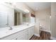 Bathroom featuring an oversized mirror and double sink vanity, complemented by stylish modern fixtures at 7805 Tuscan Ridge Dr, Wendell, NC 27591
