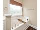 Soaking tub by a window with a bamboo shade, with ledge and a modern faucet at 7805 Tuscan Ridge Dr, Wendell, NC 27591
