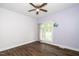 Cozy bedroom with hardwood flooring and a window with scenic views at 7805 Tuscan Ridge Dr, Wendell, NC 27591