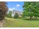 Charming home with manicured lawn, mature trees, and a well-maintained exterior nestled on a spacious lot at 7805 Tuscan Ridge Dr, Wendell, NC 27591