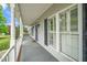 Inviting front porch showing white pillars, dark shutters and a 'Welcome' mat at 7805 Tuscan Ridge Dr, Wendell, NC 27591
