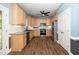 Well-lit kitchen with light wood cabinets, stainless steel appliances, and wood flooring at 7805 Tuscan Ridge Dr, Wendell, NC 27591