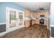 Bright eat-in kitchen with stainless steel appliances, light cabinets, and access to an outdoor deck at 7805 Tuscan Ridge Dr, Wendell, NC 27591
