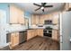 Modern kitchen with light wood cabinets, granite countertops and stainless steel appliances at 7805 Tuscan Ridge Dr, Wendell, NC 27591