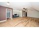 Cozy living area with wood-look floors, accent wall and ample natural light at 7805 Tuscan Ridge Dr, Wendell, NC 27591