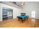 Open-concept living room featuring hardwood floors, fireplace, and vaulted ceilings at 7805 Tuscan Ridge Dr, Wendell, NC 27591