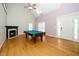 Spacious living room with hardwood flooring, fireplace, and natural lighting at 7805 Tuscan Ridge Dr, Wendell, NC 27591