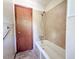 Bathroom featuring a classic white bathtub and shower combo at 80 Dunn Rd, Louisburg, NC 27549