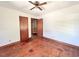 Spacious bedroom featuring hardwood floors and a ceiling fan at 80 Dunn Rd, Louisburg, NC 27549