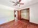 Bedroom featuring hardwood floors, a closet, and ceiling fan at 80 Dunn Rd, Louisburg, NC 27549