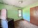 Bedroom featuring vintage dresser and natural light from one window at 80 Dunn Rd, Louisburg, NC 27549