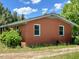 Side view of a single-story brick home with two windows at 80 Dunn Rd, Louisburg, NC 27549