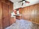 Classic kitchen with wood cabinets, laminate countertops, and a view into the backyard at 80 Dunn Rd, Louisburg, NC 27549