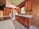 This kitchen features wood cabinets, laminate countertops, and a vintage design at 80 Dunn Rd, Louisburg, NC 27549