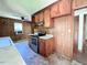 This kitchen offers wood cabinets, laminate countertops, and stainless steel appliances at 80 Dunn Rd, Louisburg, NC 27549