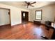 Cozy living room features hardwood floors, a ceiling fan, and natural light from a window at 80 Dunn Rd, Louisburg, NC 27549
