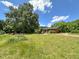 Large grassy lot with a single-story brick house at 80 Dunn Rd, Louisburg, NC 27549