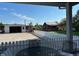 View of a spacious backyard, shed, and building with outdoor seating from the covered patio at 8019 W Tarboro Rd, Rocky Mount, NC 27803
