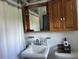 Well-lit bathroom with modern fixtures and ample storage at 8019 W Tarboro Rd, Rocky Mount, NC 27803