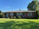 Charming one story home with brick exterior and well-manicured lawn at 8019 W Tarboro Rd, Rocky Mount, NC 27803