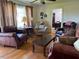 Comfortable living room with hardwood floors and leather furniture at 8019 W Tarboro Rd, Rocky Mount, NC 27803