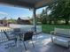 Covered patio with outdoor seating, featuring a nice grassy backyard and building at 8019 W Tarboro Rd, Rocky Mount, NC 27803