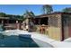 Outdoor pool and tiki bar perfect for entertaining guests on a sunny day at 8019 W Tarboro Rd, Rocky Mount, NC 27803
