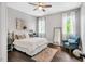 Cozy bedroom with hardwood floors, bright windows, and stylish furnishings at 808 Wimberly Rd, Apex, NC 27523