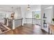 Inviting foyer with hardwood floors, elegant lighting, and staircase at 808 Wimberly Rd, Apex, NC 27523