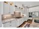 Modern kitchen with white cabinets, granite countertops, and stainless steel appliances at 808 Wimberly Rd, Apex, NC 27523
