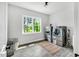 Functional laundry room with modern washer and dryer, and tile floors at 808 Wimberly Rd, Apex, NC 27523