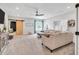 Inviting living room with cozy sofa, sliding barn door and a view of the yard at 808 Wimberly Rd, Apex, NC 27523