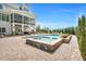 Inviting backyard pool with a spa, stone accents, and an outdoor patio with ample seating and a covered porch at 808 Wimberly Rd, Apex, NC 27523