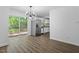 Dining room with stainless steel refrigerator and view to backyard through sliding door at 81 Honeysuckle Dr, Pittsboro, NC 27312