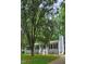 Charming single-story home with a classic gray exterior, white trim, and a welcoming front porch at 81 Honeysuckle Dr, Pittsboro, NC 27312