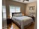Serene bedroom with hardwood floors, a queen bed, soft lighting, and window with lots of natural light at 84 Macbeth Ln, Roxboro, NC 27574