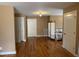 An empty bedroom features hardwood floors and multiple white paneled doors at 84 Macbeth Ln, Roxboro, NC 27574