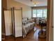 Bedroom setup as sewing room with hardwood floors, a window and neutral walls at 84 Macbeth Ln, Roxboro, NC 27574
