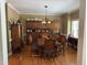Formal dining room showcasing hardwood floors and elegant wood furniture and built-in cabinet at 84 Macbeth Ln, Roxboro, NC 27574